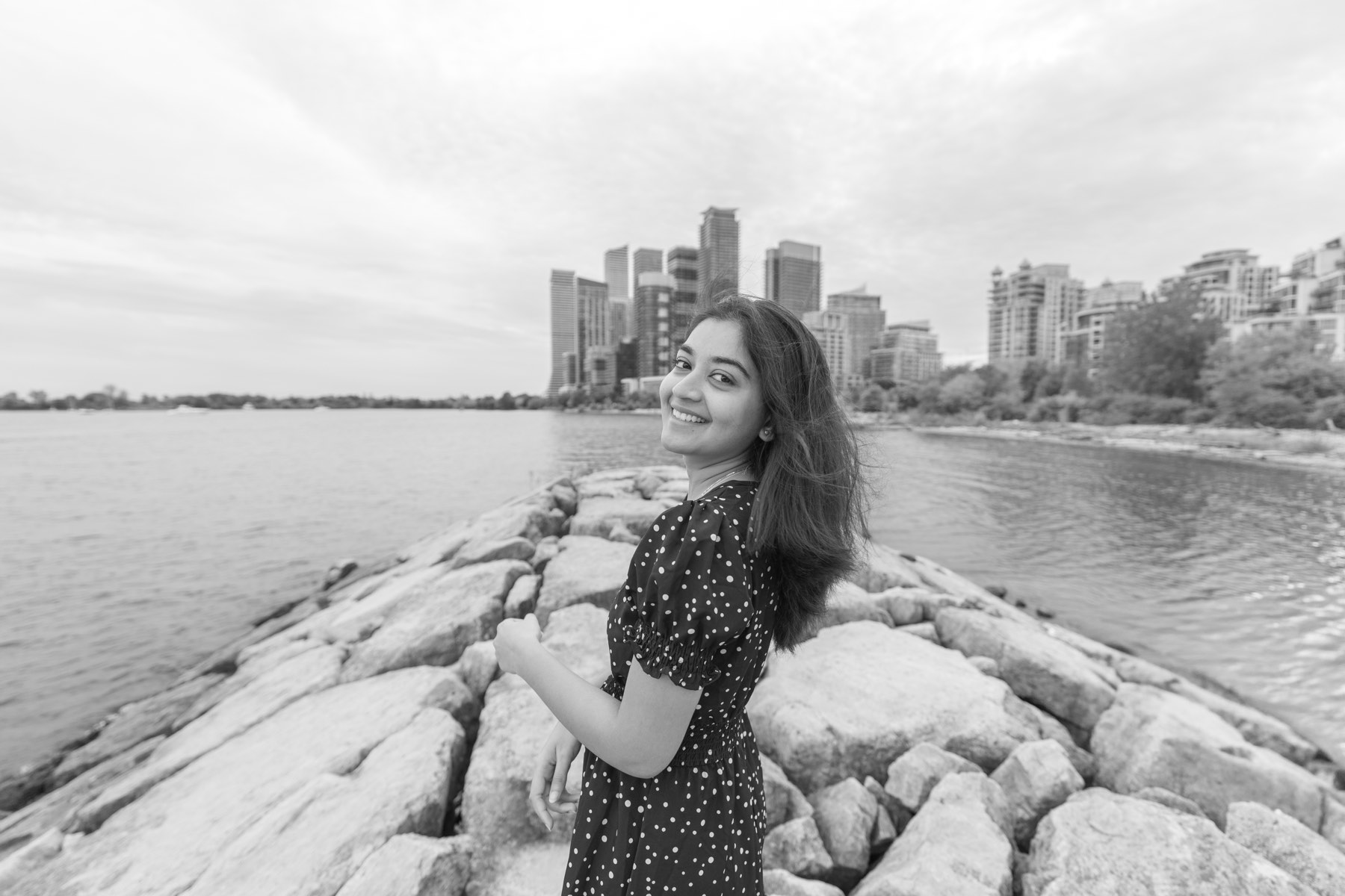 A black-and-white studio portrait photographed by Smritika Moments